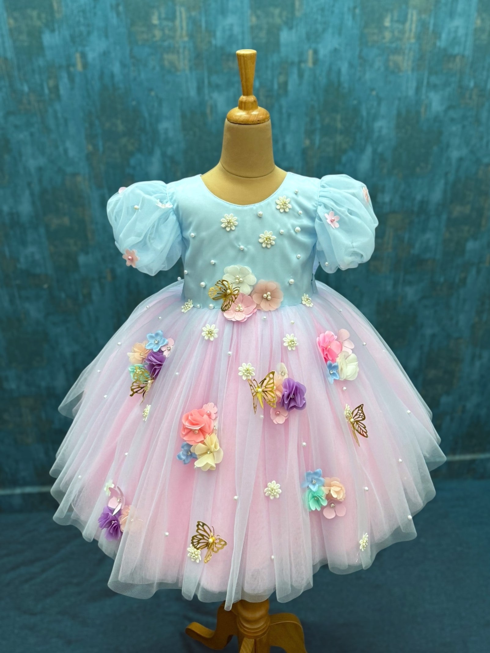 pink and blue floral gown with puff sleeves