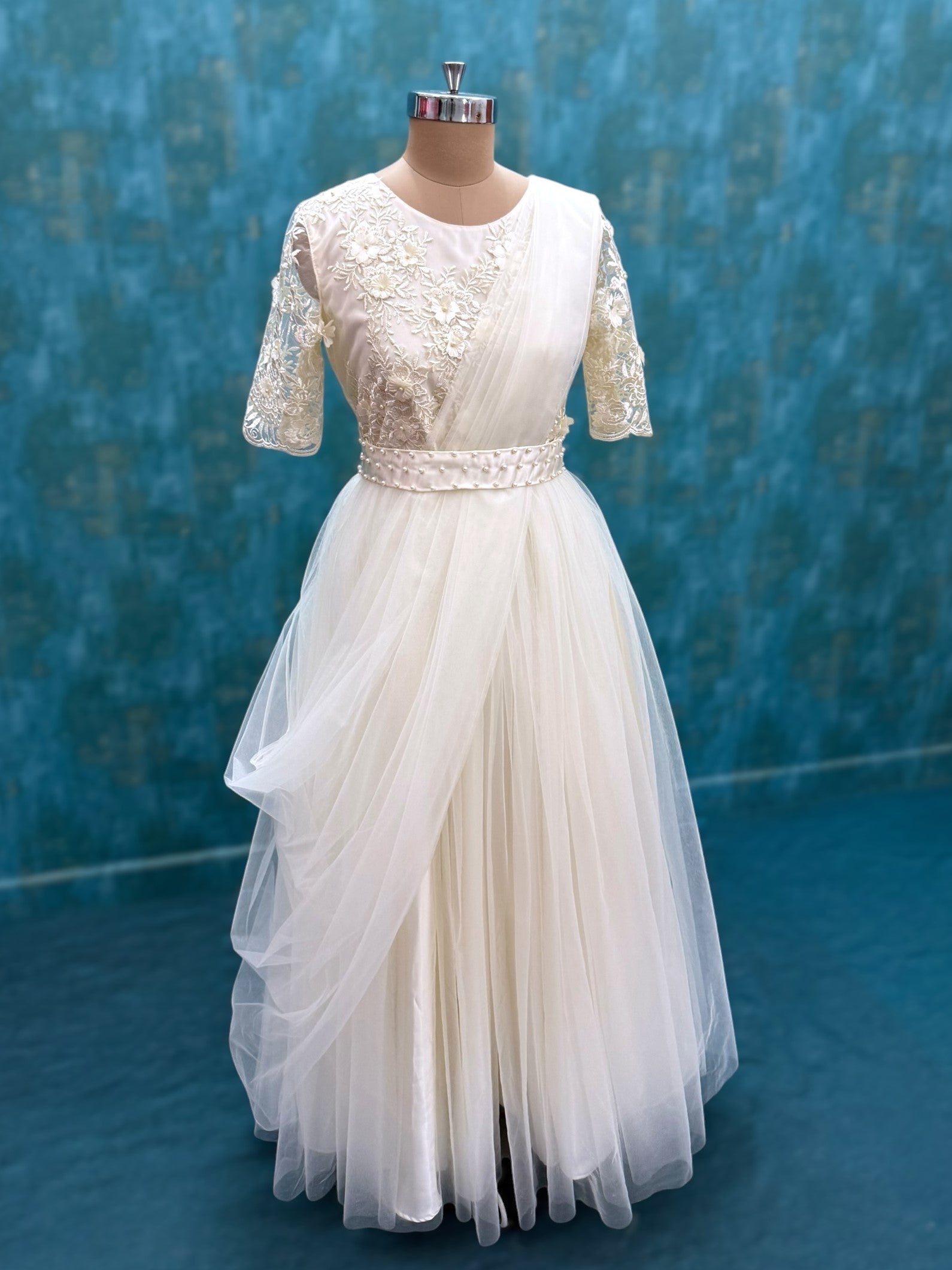 Half white floral net gown with attached dupatta and waist belt