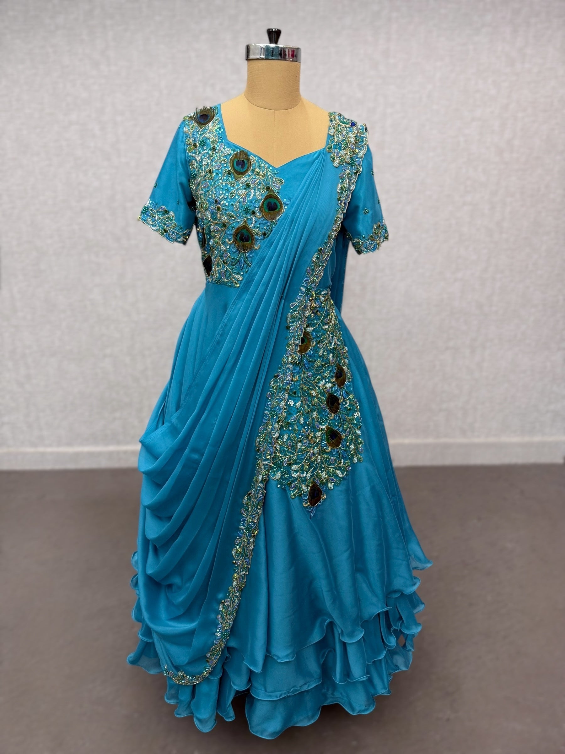 Peacock saree gown with draped dupatta and waist belt