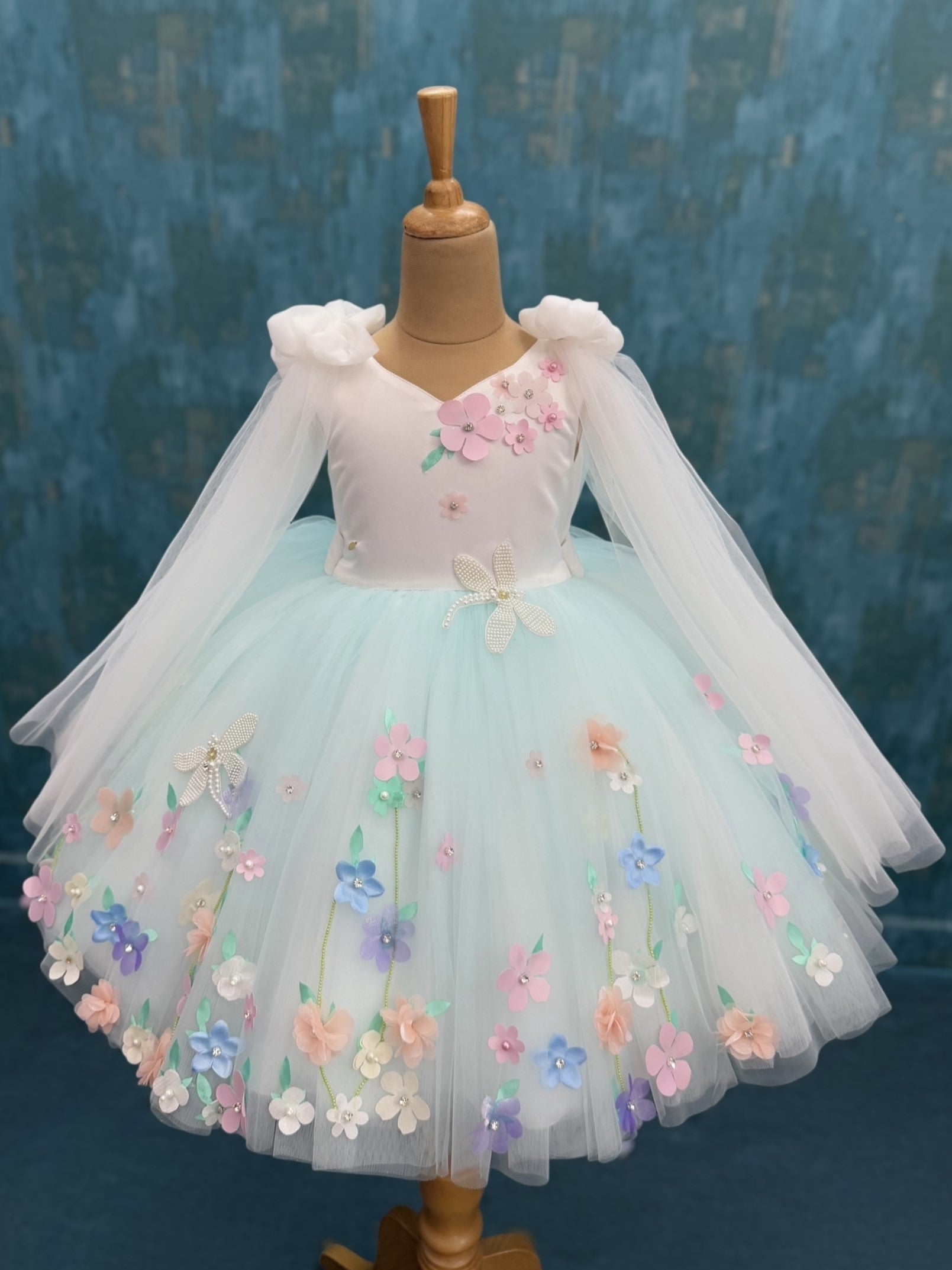 White and blue floral ball gown with bow shoulders