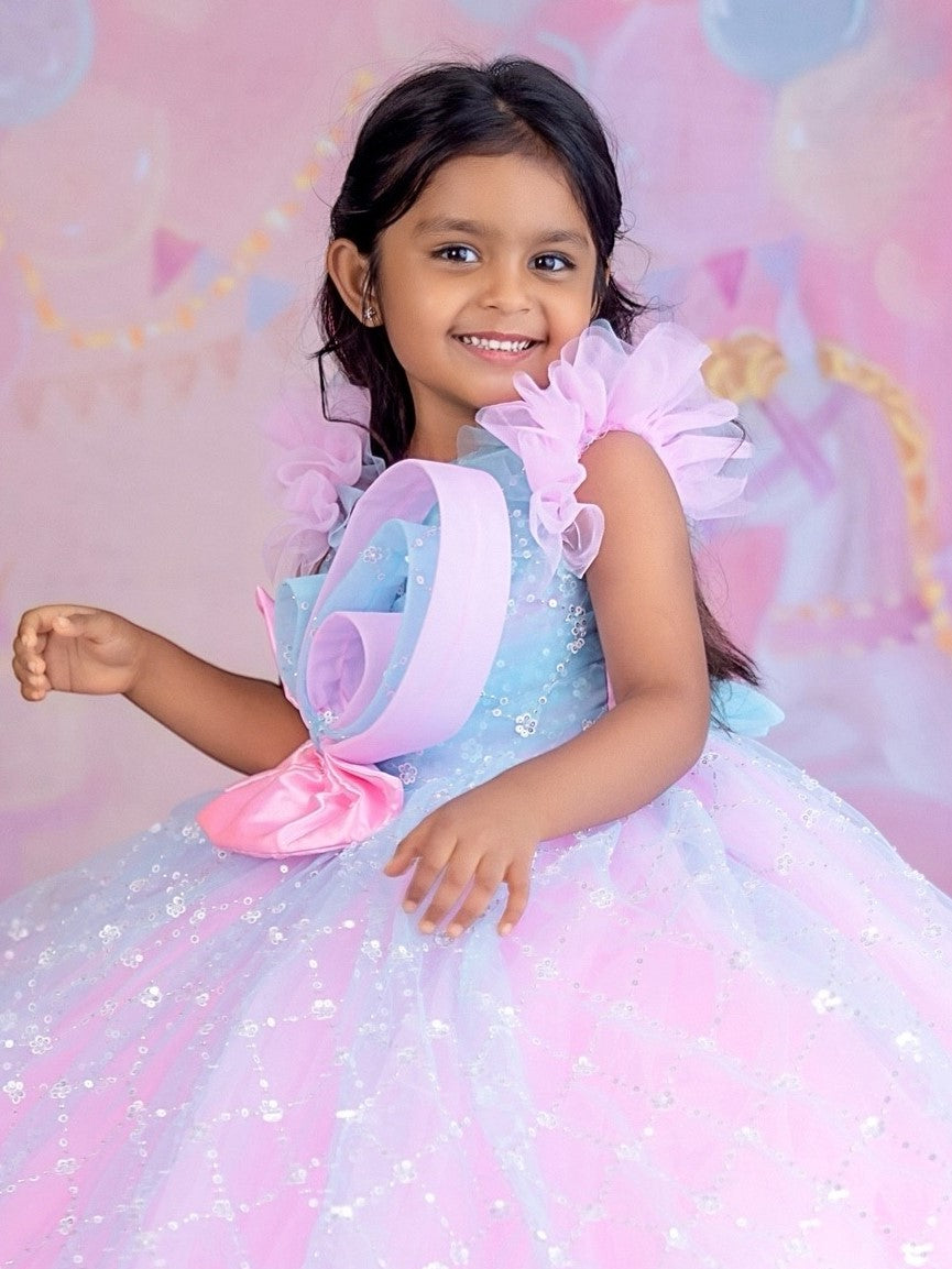 Blue and pink sequence ball gown with bow detailing