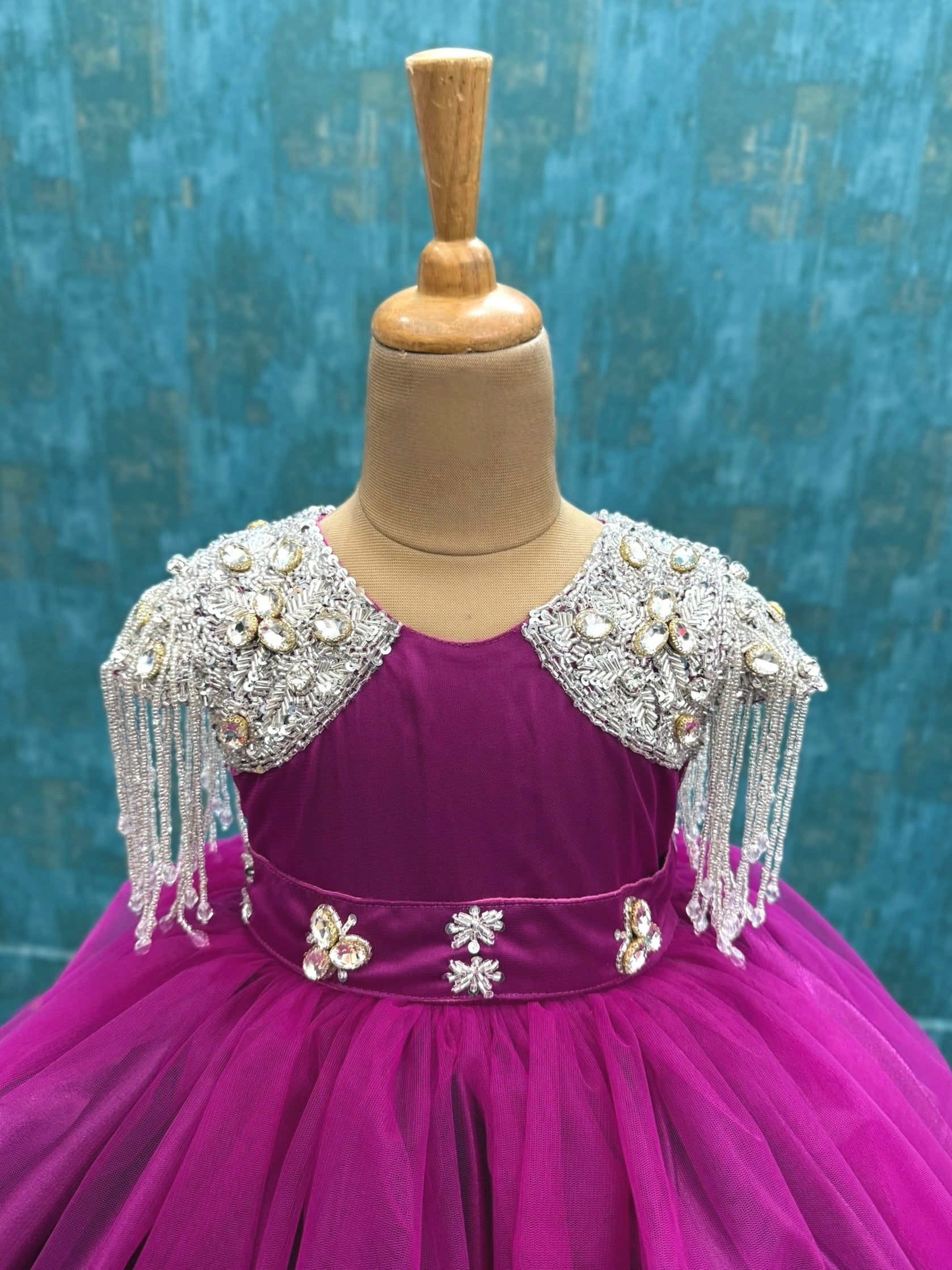 dreamy magenta gown with crystal hanging sleeves and waist belt