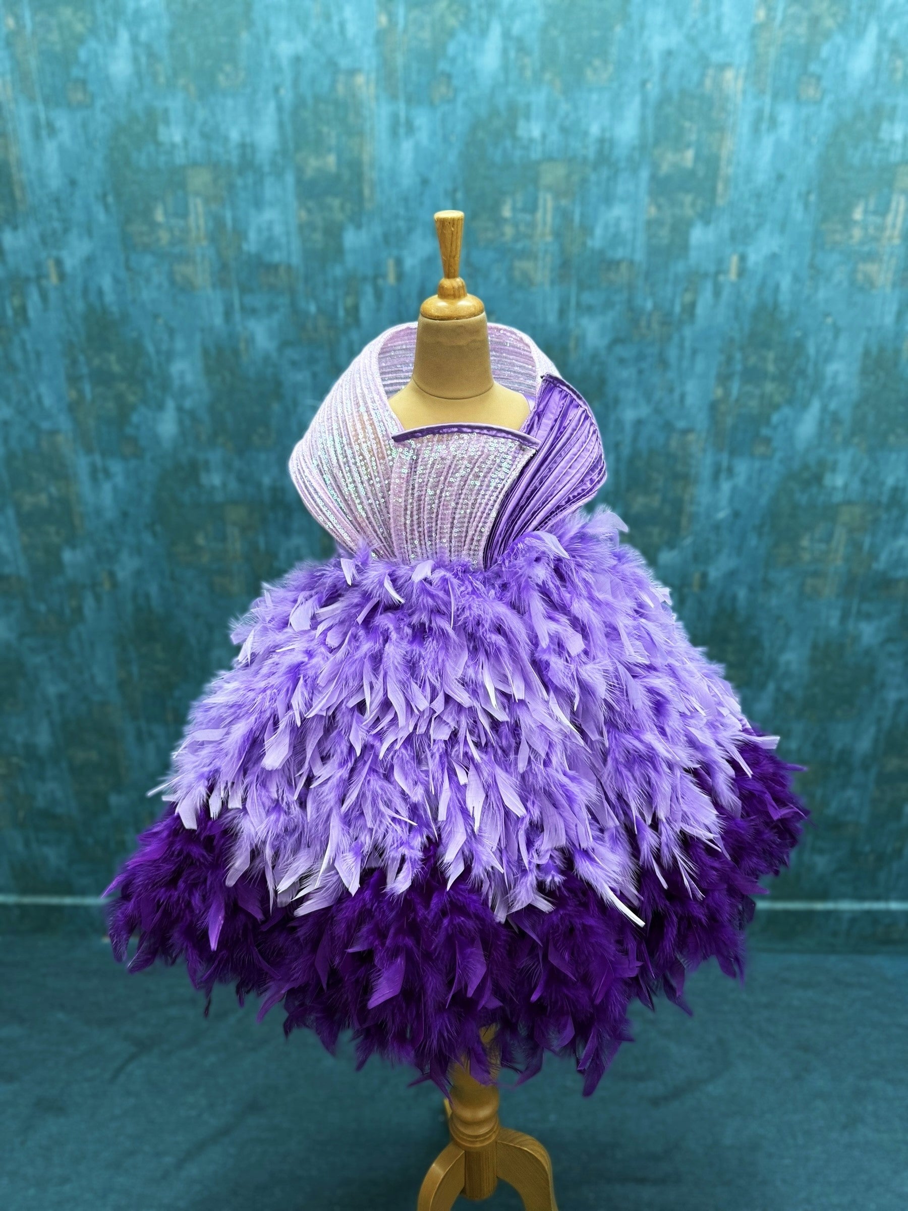 lavender and purple feather ball gown with sequenced structure top