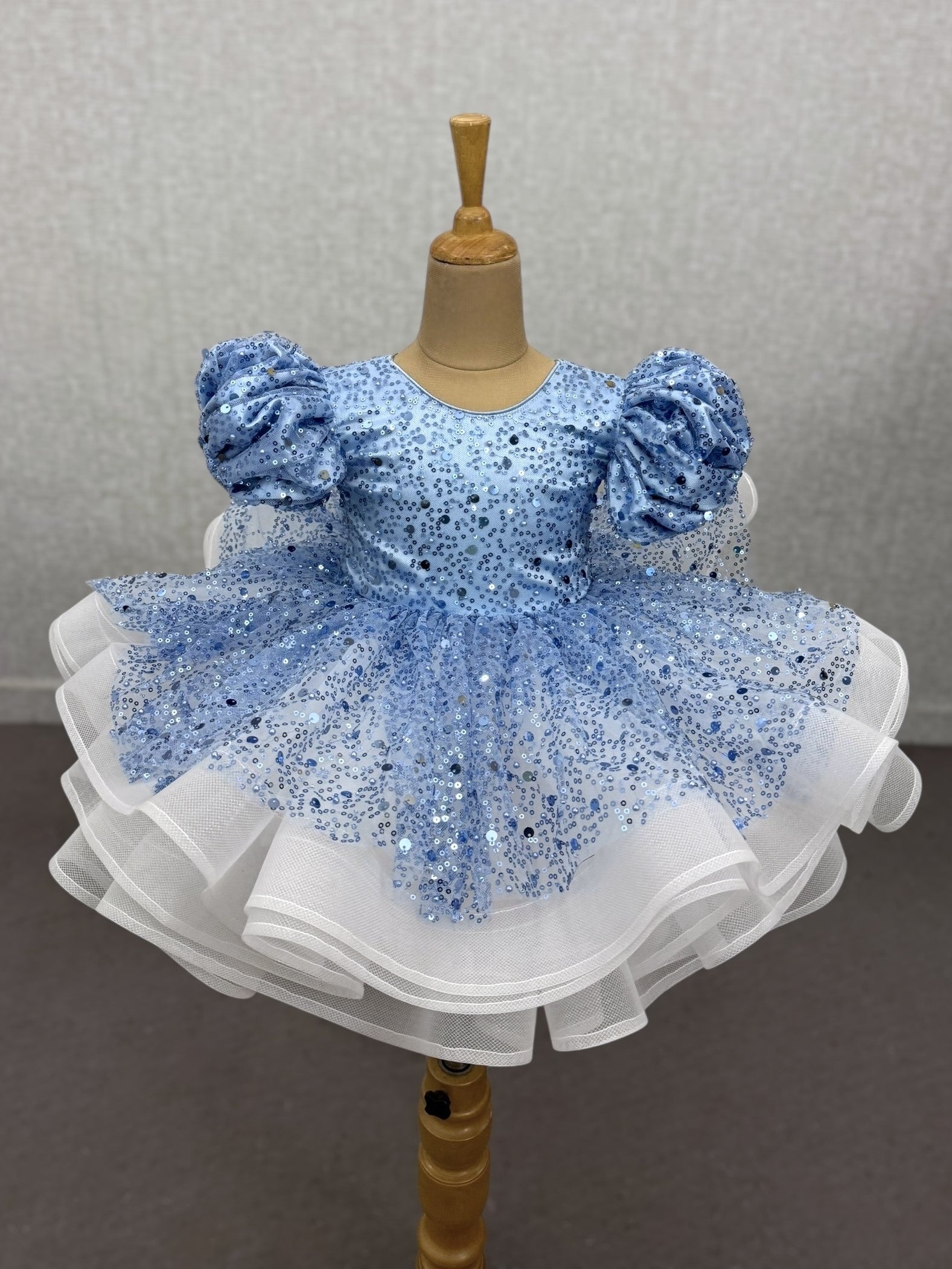 powder blue and white sequence layer gown with puff sleeves