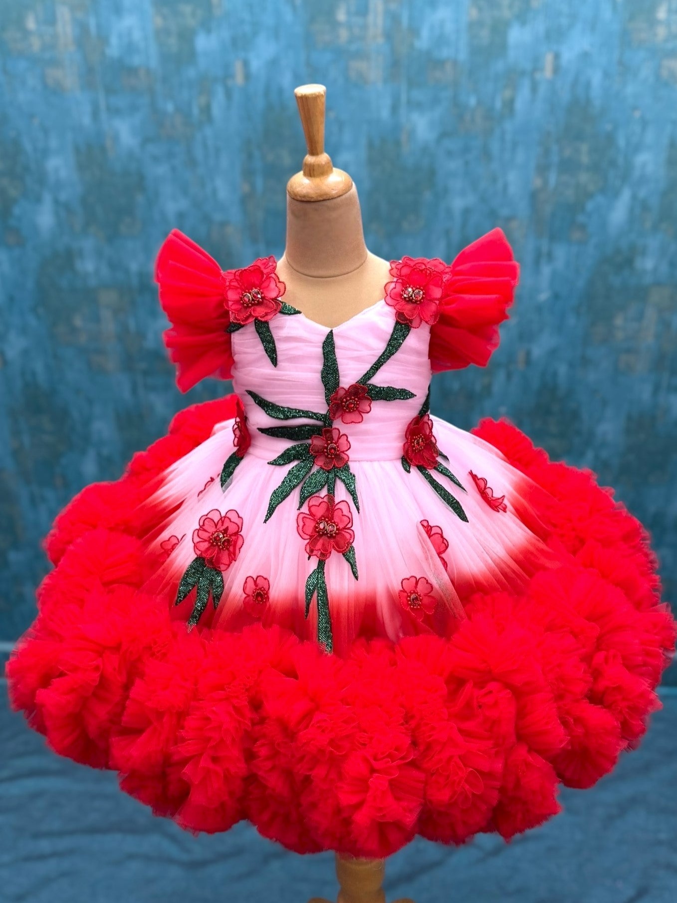 Peach And red double shade couture gown with hand crafted flowers and leaves