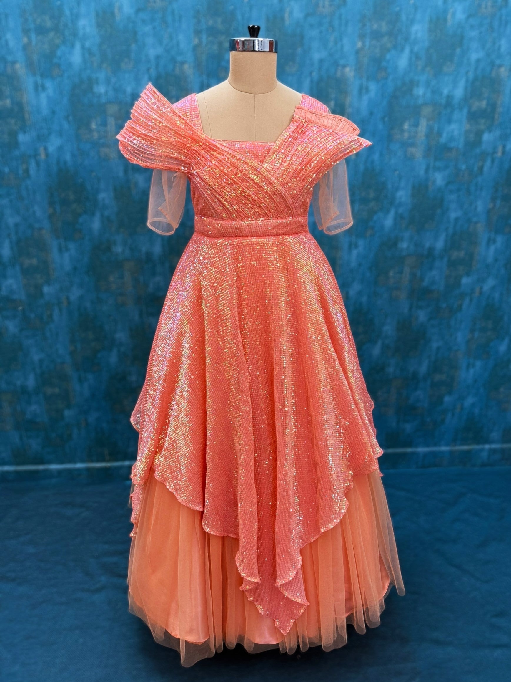 Structured sequence peach gown with uneven cut skirt