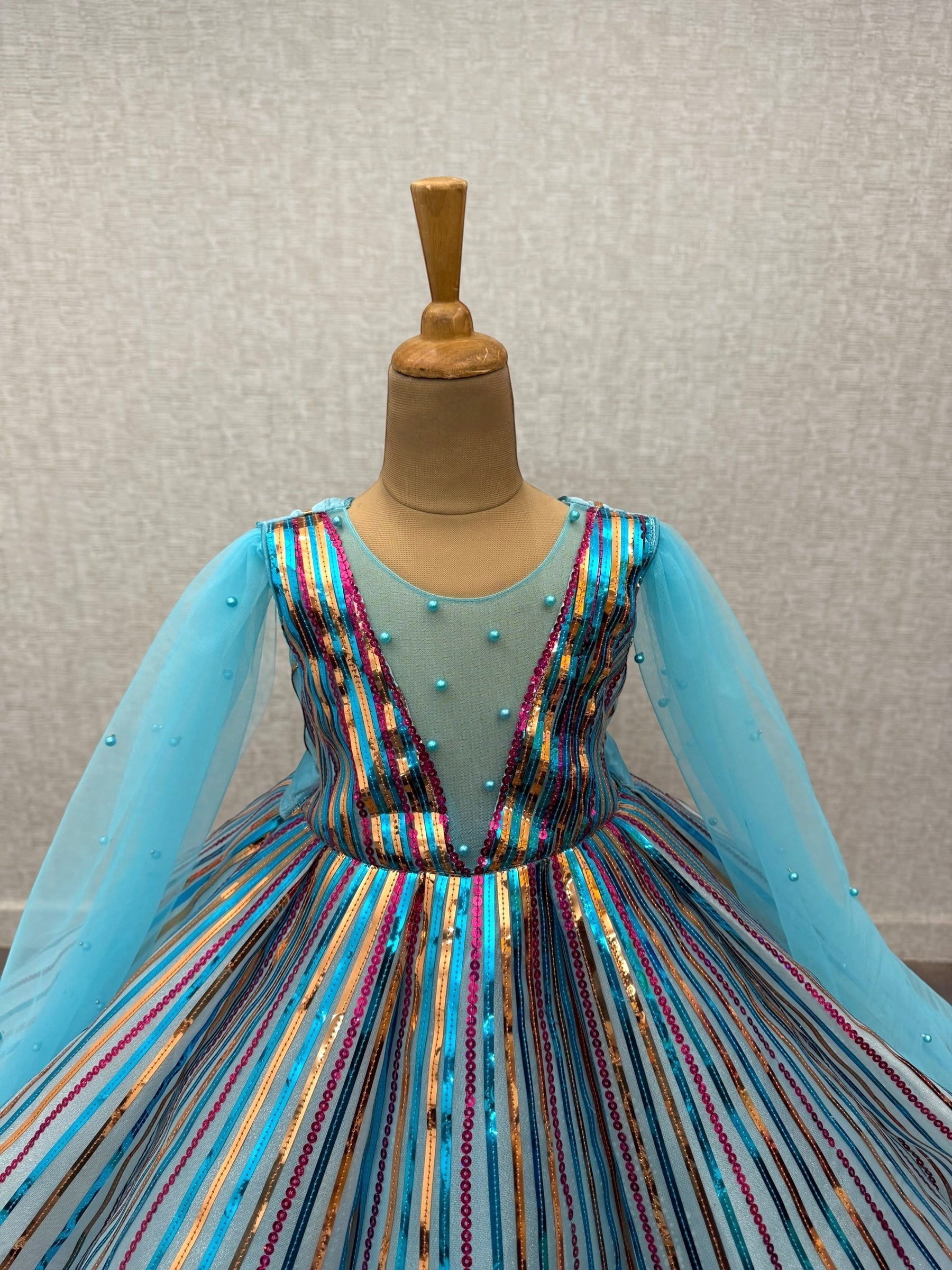 radiant blue sequenced panel gown with flowing sleeves