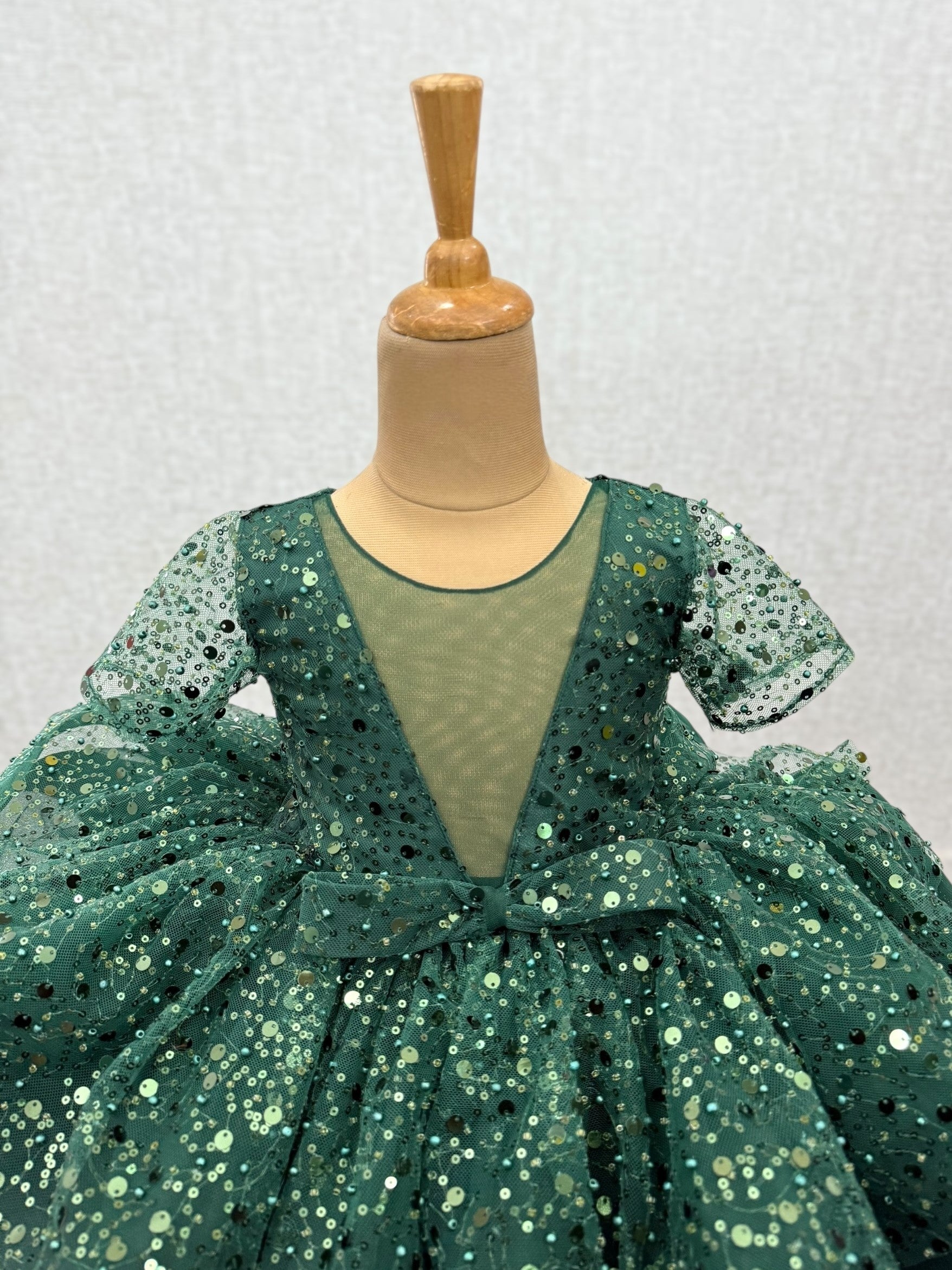 green sequence layer gown with bow