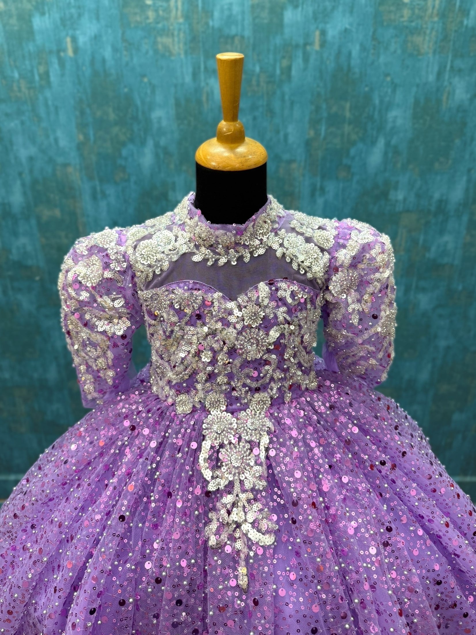 lavender sequence ball gown with high neck and puff sleeves with silver intricate work