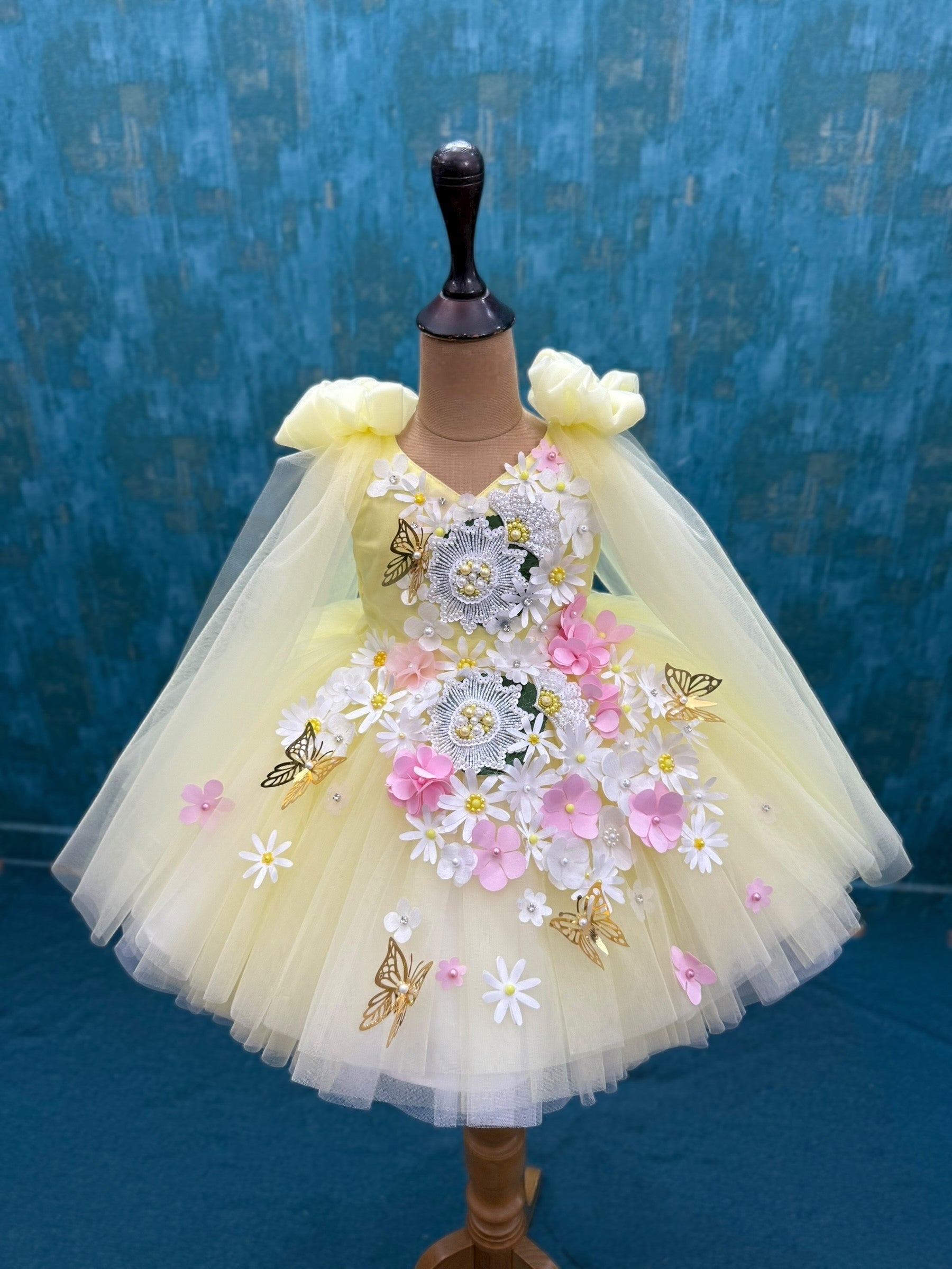yellow and white floral and butterfly ball gown with intricate work