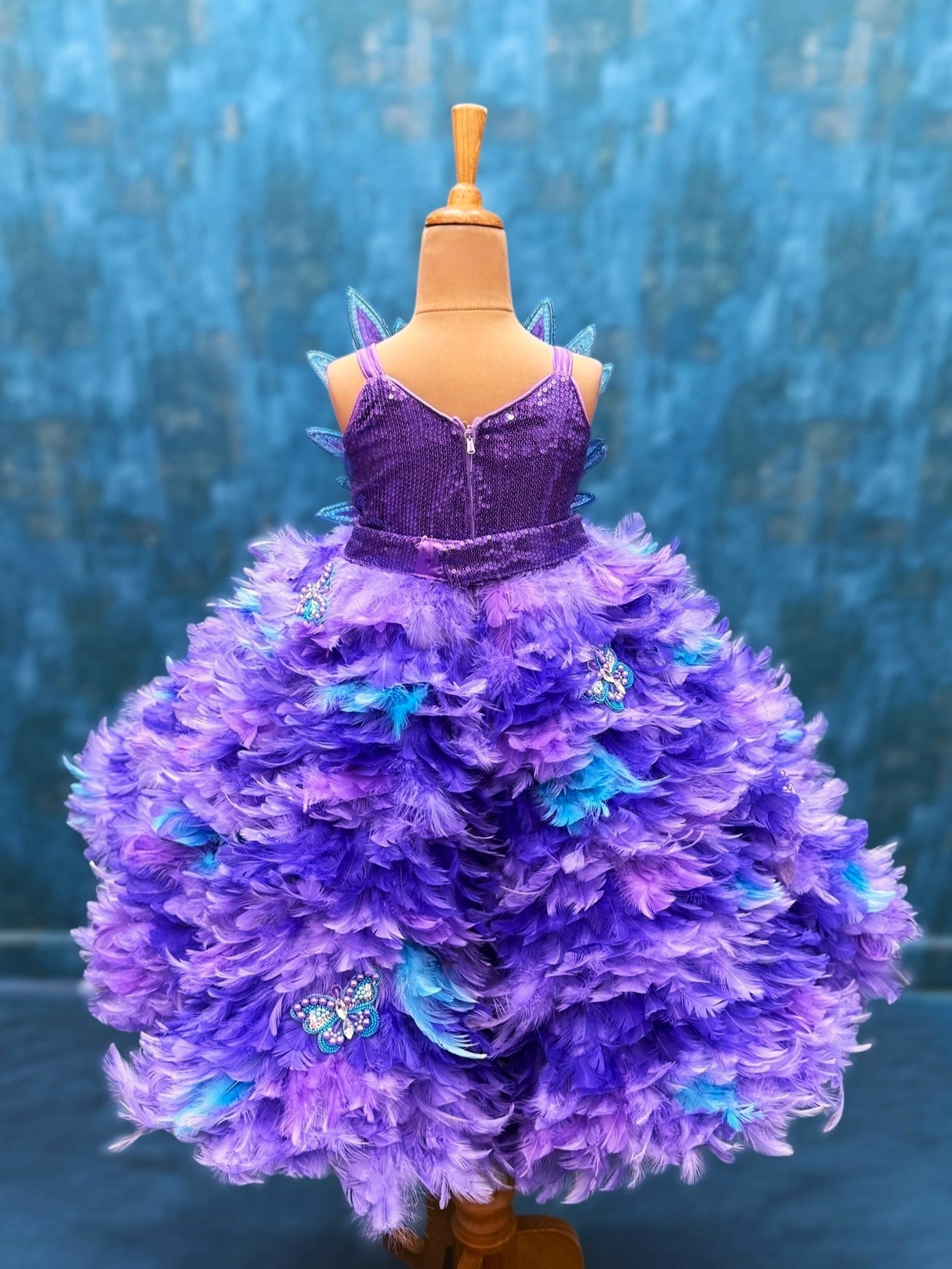 purple ombre feather panel gown with heavy petal embroidery top