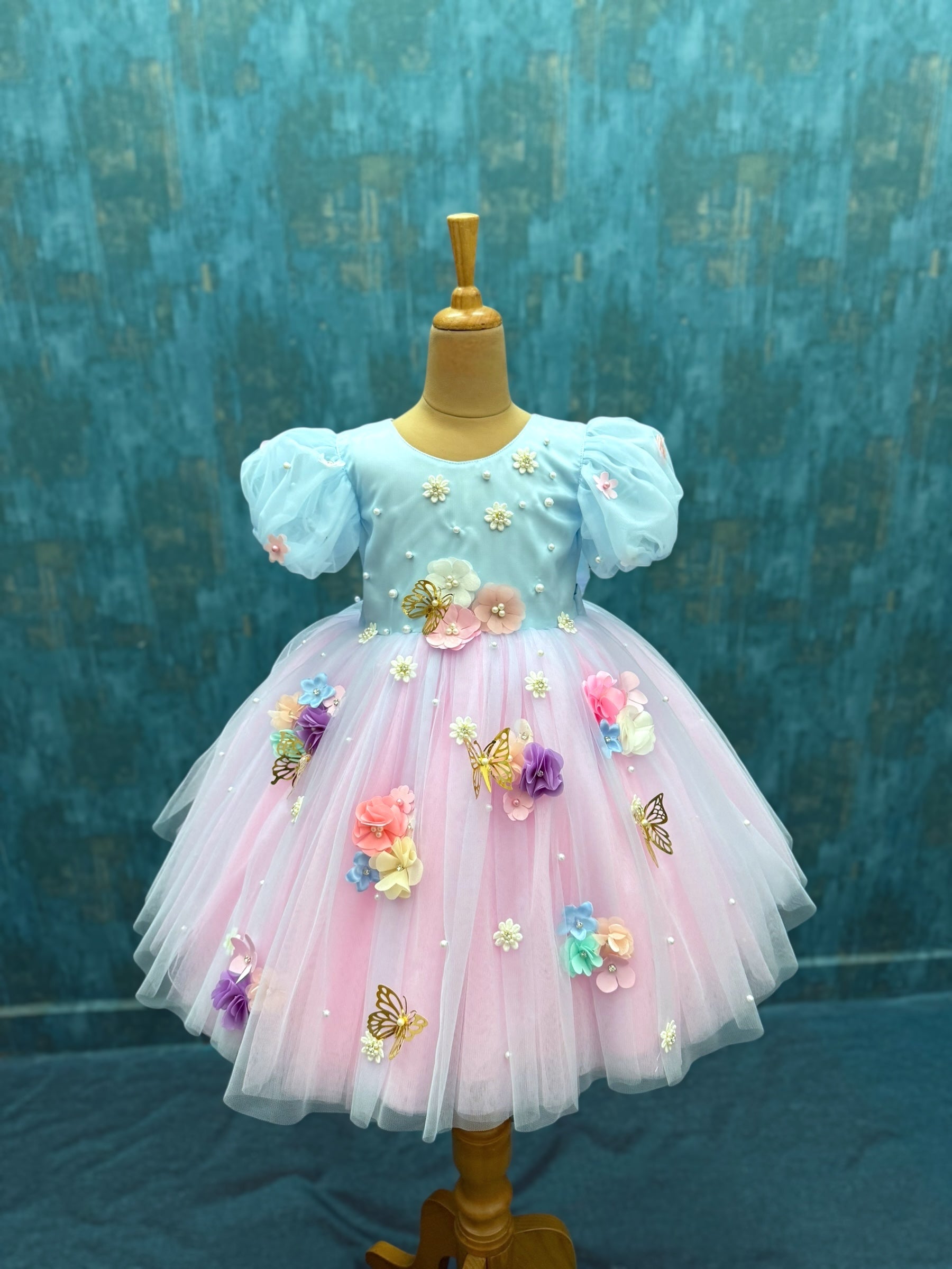 pink and blue floral gown with puff sleeves