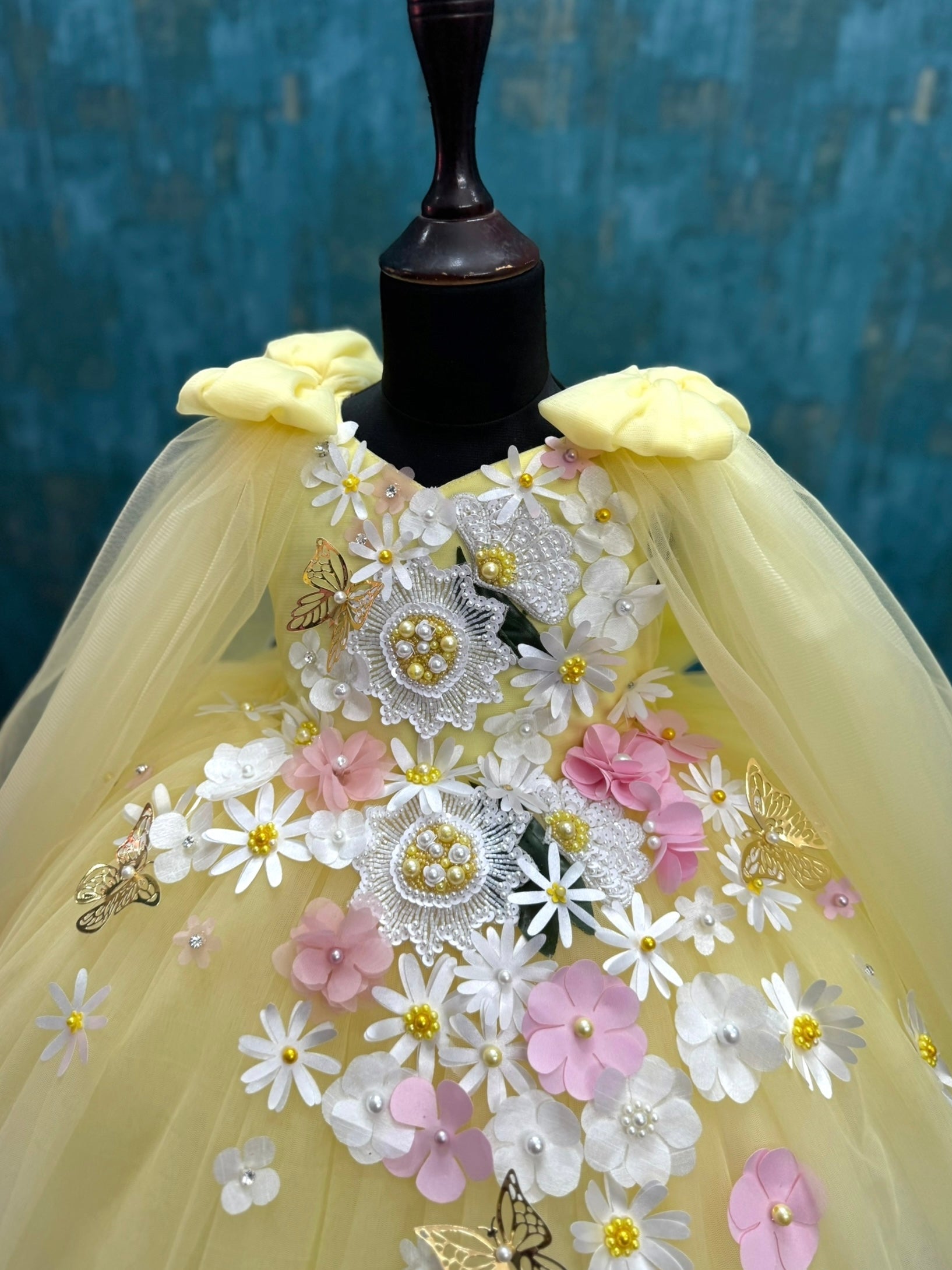 yellow and white floral and butterfly ball gown with intricate work