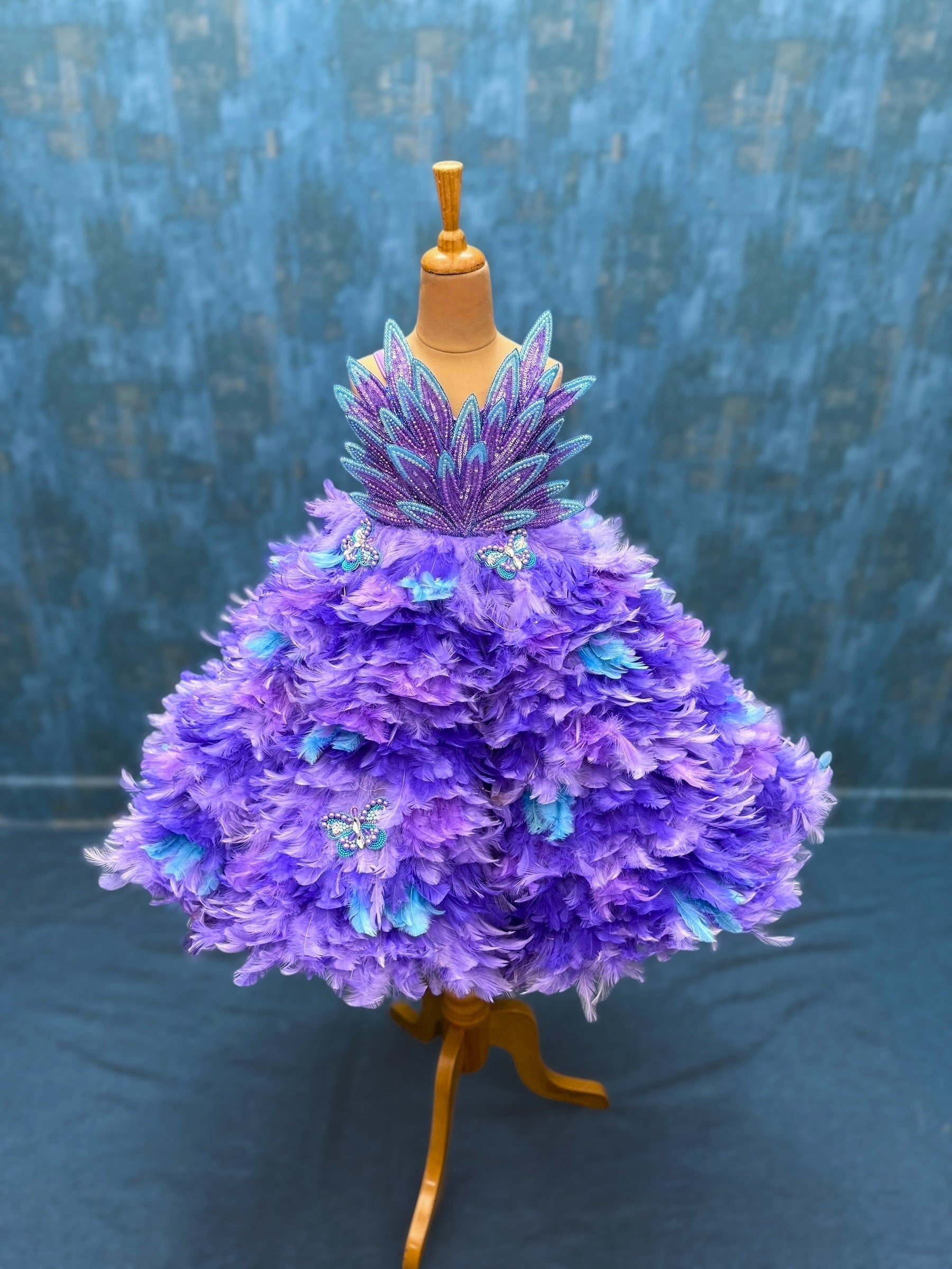 purple ombre feather panel gown with heavy petal embroidery top