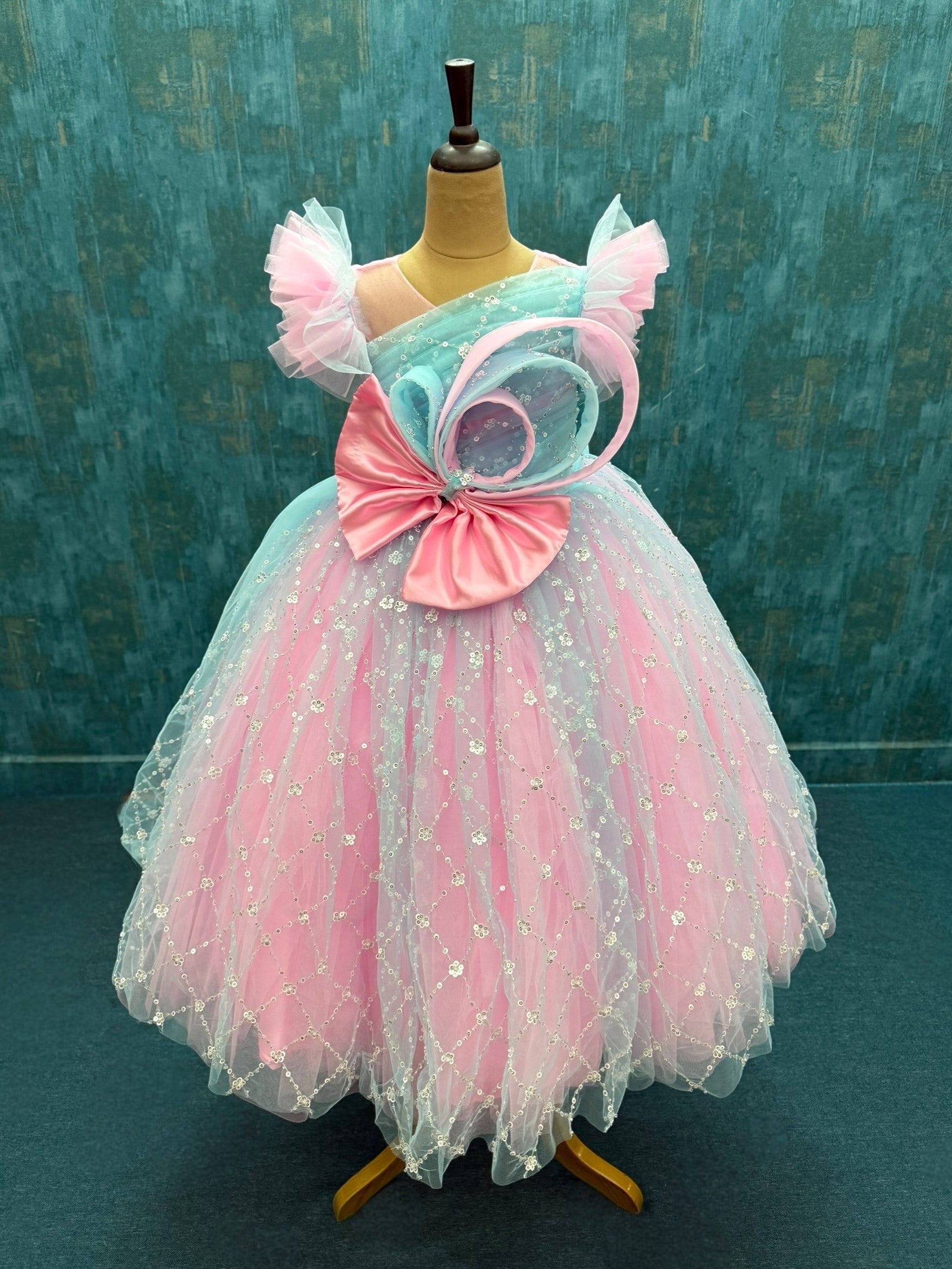 Blue and pink sequence ball gown with bow detailing