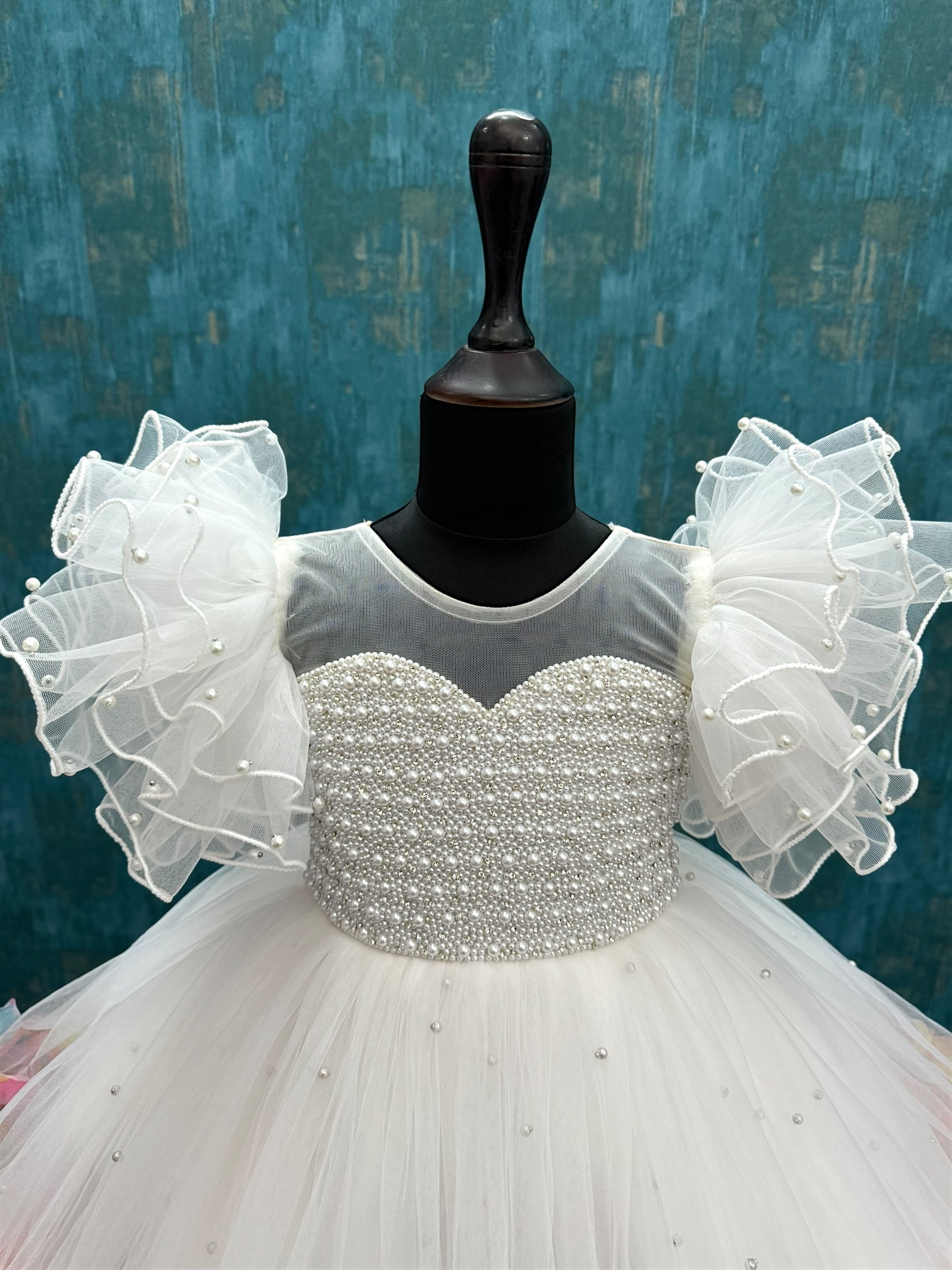 white Enchanted Rosalina Garden gown with pearl work top