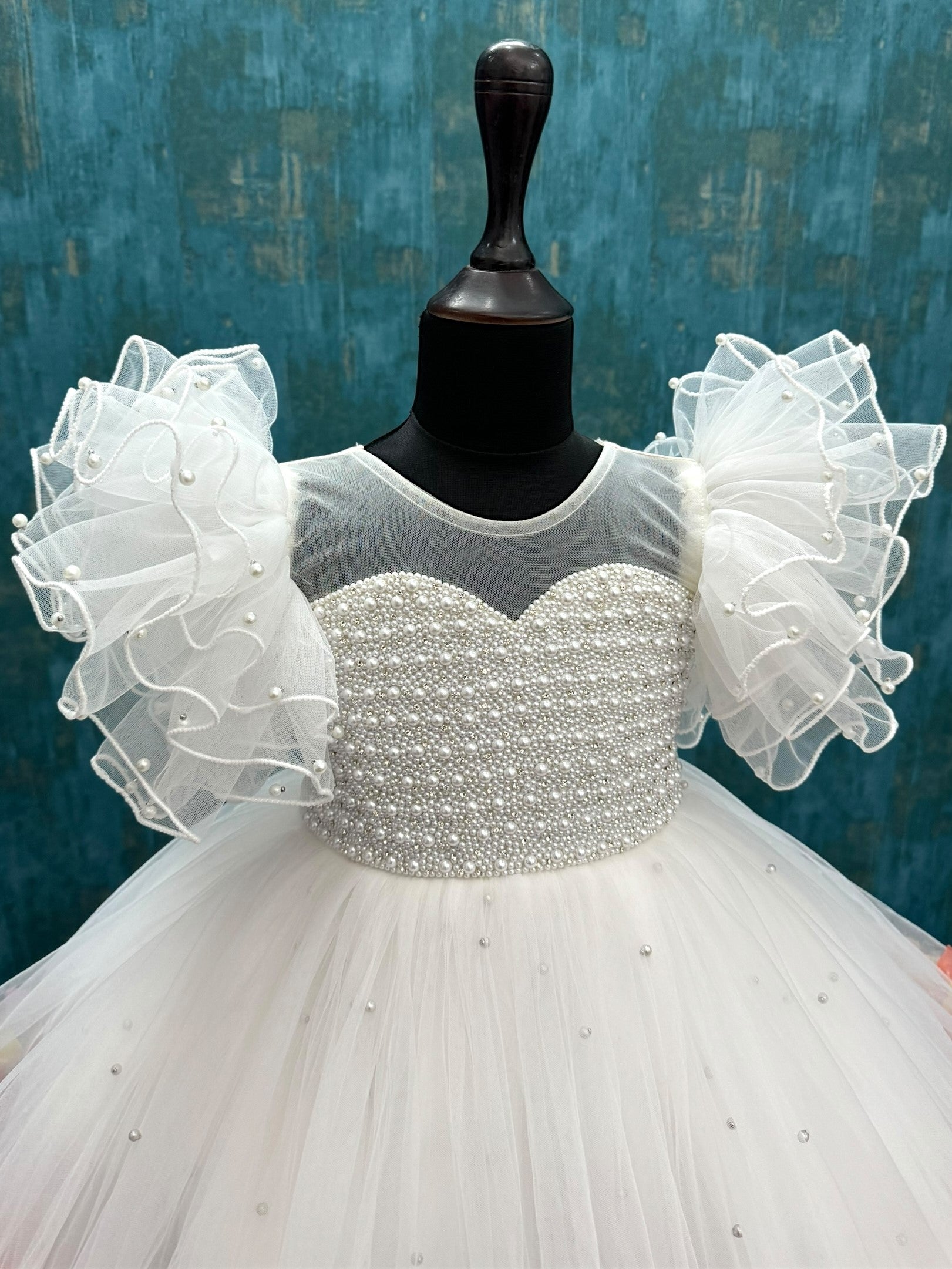 white Enchanted Rosalina Garden gown with pearl work top